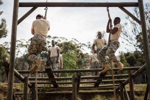 Military soldiers training rope climbing